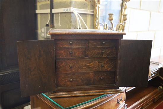 An Edwardian stained beech collectors cabinet, W.38cm, H.30cm